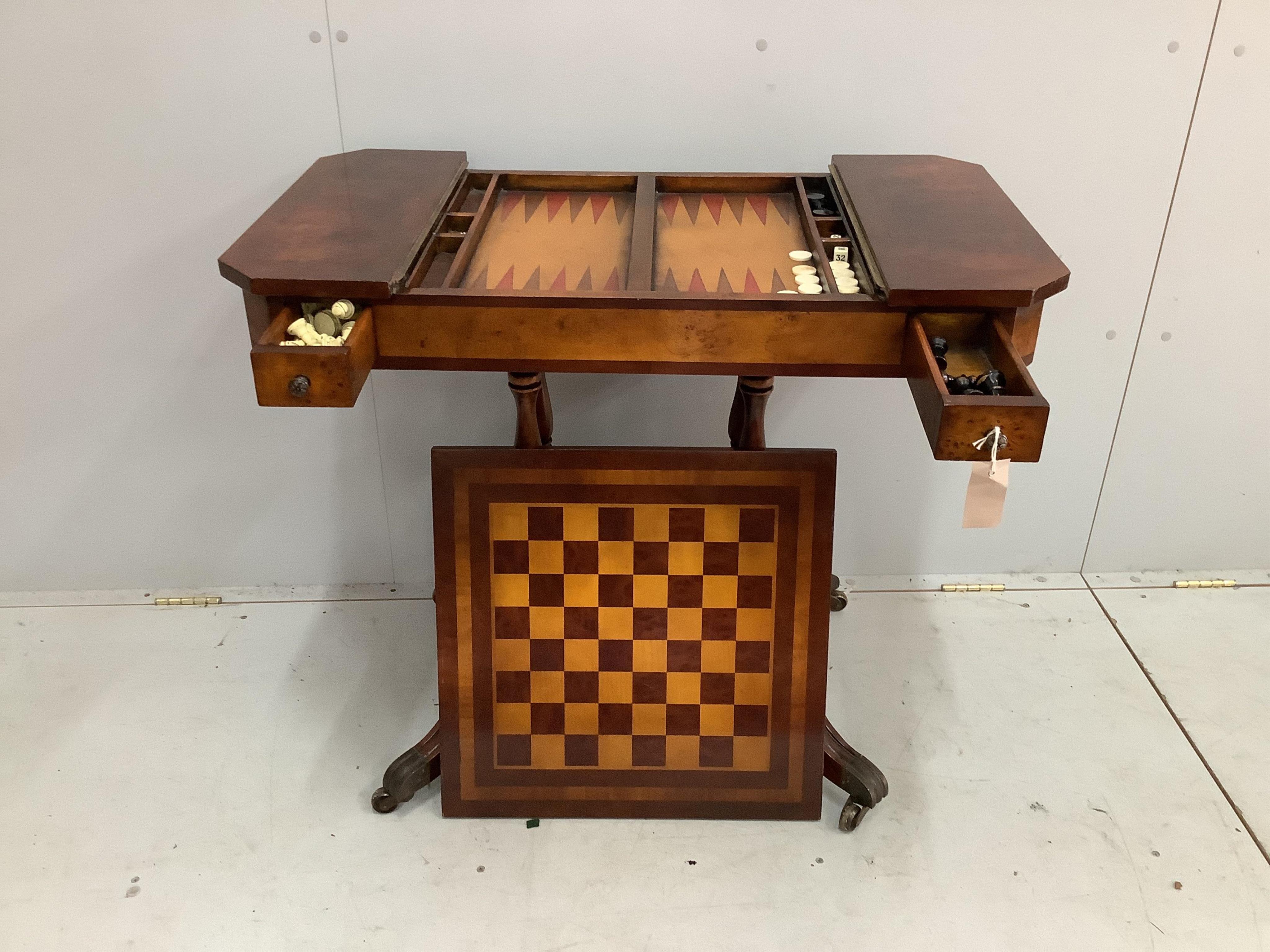 A reproduction bird's eye maple games table, with chess and backgammon surfaces, width 89cm, depth 50cm, height 76cm. Condition - fair